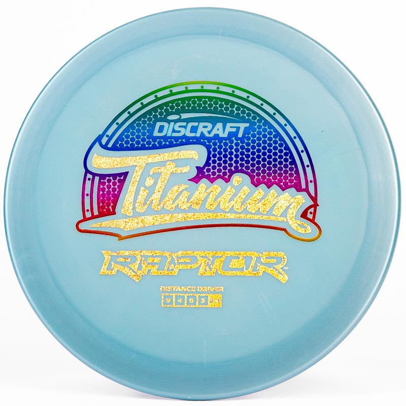 A blue Discraft Raptor with a gold and rainbow stamp